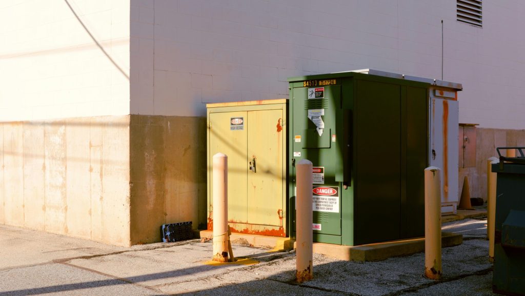 a green box on a concrete surface